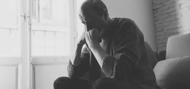 Depressed overwhelmed old man